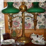 DL02. Double student lamps with torch decoration and green glass shades.